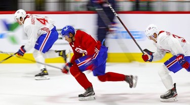 Rafael Harvey-Pinard, left, Isiah Campbell and Gianni Fairbrother, right, take a fast lap during first day of Montreal Canadiens' rookie camp at the Bell Sports Complex in Brossard on Thursday, Sept. 16, 2021.