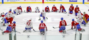 Players stretch during first day of Montreal Canadiens' rookie camp at the Bell Sports Complex in Brossard on Thursday, Sept. 16, 2021.