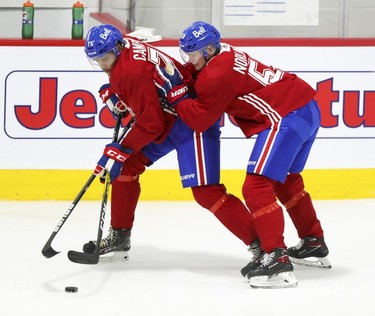 Mattias Norlinder, right, leans on Isiah Campbell during first day of Montreal Canadiens' rookie camp at the Bell Sports Complex in Brossard on Thursday, Sept.16, 2021.
