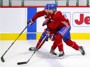 Mattias Norlinder, right, leans on Isiah Campbell during first day of Canadiens rookie camp at the Bell Sports Complex in Brossard on Thursday.