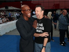 Ted Lasso stars Moe Jeudy-Lamour, left, and Jason Sudeikis during a break in shooting.