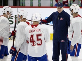 Canadiens head coach Dominique Ducharme speaks with players during practice Wednesday at the Bell Sports Complex in Brossard.