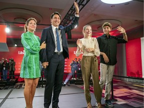 Justin Trudeau, accompanied by his wife, Sophie Gregoire, and children Ella-Grace and Xavier, waves to supporters at Liberal Party headquarters in Montreal on election night.