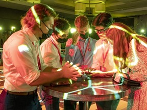 Liberal supporters watch election results at Liberal Party headquarters in Montreal on Sept. 20, 2021.