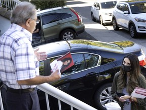 Emmanuella Lambropoulos, the Liberal candidate in the St-Laurent riding, speaks to a voter in her riding on Sept. 16, 2021.