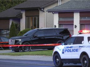 Crime scene tape around a home on Lévesque Blvd. in Laval, north of Montreal Tuesday Sept. 21, 2021. The owner of the home, Davide Barberio, was shot and wounded outside his house Tuesday afternoon.