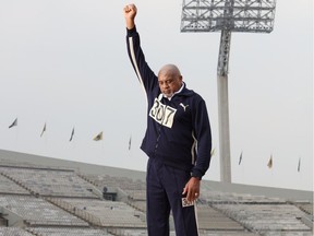 American Olympian Tommie Smith recreates his memorable clenched fist on the podium after winning gold at the '68 Mexico games. The image is from the documentary With Drawn Arms, being presented Wednesday at the Montreal International Black Film festival.