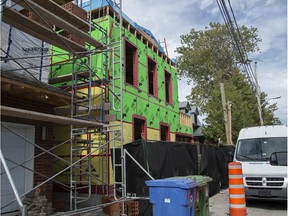 A new home (green cladding) is being built at 4 St. Joachim Ave. in Pointe-Claire after an older home was demolished without a city permit last year.