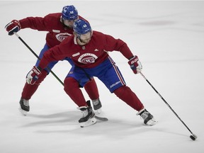 Joel Armia, front, battles Terrance Amorosa during first day of Canandiens' on-ice training camp on Sept. 23, 2021.