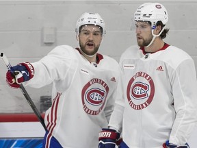 Jonathan Drouin (left) and Josh Anderson chat Thursday morning as the Canadiens hit the ice for the first time during training camp at the Bell Sports Complex in Brossard.