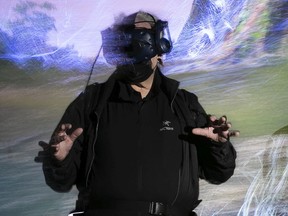 Montreal Gazette columnist Bill Brownstein goes through the new We Live in an Ocean of Air at the Phi Centre on Tuesday.