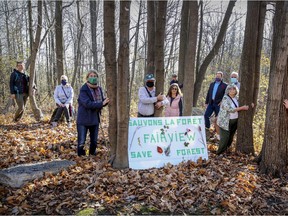 Save the Fairview Forest members gather in the wooded area west of the Fairview Pointe-Claire shopping centre in November 2020. Cadillac Fairview proposes to develop the woods.