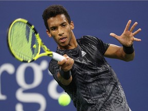 Felix Auger-Aliassime of Canada returns against Roberto Bautista Agut of Spain during his Men's Singles third round match on Day Five at USTA Billie Jean King National Tennis Center on September 03, 2021 in New York City.