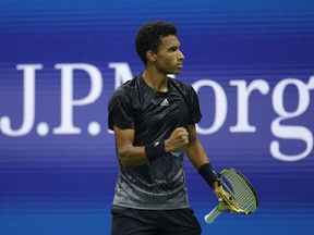 Félix Auger-Aliassime of Canada reacts against Carlos Alcaraz of Spain during his Men's Singles quarterfinals match on Day Nine of the 2021 US Open