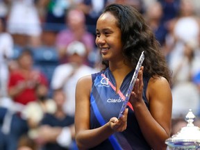 Leylah Annie Fernandez of Laval celebrates with the runner-up trophy after being defeated by Emma Raducanu of Great Britain during their women's singles final match at the U.S. Open at the USTA Billie Jean King National Tennis Center on Saturday, Sept. 11, 2021, in Flushing, N.Y.