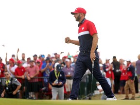 Dustin Johnson of team United States reacts as he walks off the 15th green during Sunday Singles Matches of the 43rd Ryder Cup at Whistling Straits on Sunday, Sept. 26, 2021, in Kohler, Wisconsin.