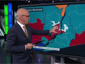 CBC's David Cochrane uses a touchscreen to show results in the federal election on Monday, Sept. 20, 2021.