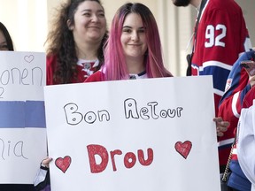 A Canadiens fan expresses support to Jonathan Drouin outside the parking garage as the Montreal Canadiens arrive for the Red vs. White scrimmage on Sunday, Sept. 26, 2021.