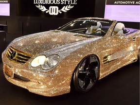 Japan's car accessory company Garson displays the demo car Luxury Crystal Benz, the Mercedes-Benz SL600 with Swarovski crystals on the whole body, at Tokyo Auto Salon 2016 at Makuhari Messe in Chiba on January 15, 2016.