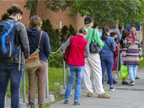 People line up outside the COVID-19 testing centre on Parc Ave. in Montreal Tuesday September 14, 2021.