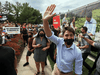 Protesters shout as Liberal Leader Justin Trudeau arrives to campaign in Nobleton, Ont., on August 27.