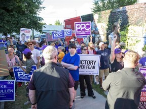 People protest against Liberal Leader Justin Trudeau during a campaign stop at the  London Co-Operative Brewing Company in London, Ont. on Monday, Sept. 6, 2021.