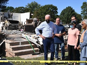 U.S. President Joe Biden tours a neighbourhood affected by Hurricane Ida in Manville, N.J. on Tuesday, Sept. 7, 2021. Biden, who is pushing a giant infrastructure spending bill, including major funding for the green economy, argues extreme weather across the United States this summer is a harbinger of worse climate change to come.