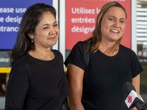 Wife of Michael Kovrig, Vina Nadjibulla, left, and his sister Ariana Botha speak to the media outside Toronto airport before seeing Michael in Toronto on Saturday, Sept. 25, 2021. Two Canadians freed from years of detention in China as part of a three way deal involving the U.S. arrived in their country and were greeted by Prime Minister Justin Trudeau. TV footage aired by CTV showed Michael Kovrig and Michael Spavor arriving in Calgary in the wee hours of Saturday when it was still dark. The two men, wearing suits and face masks, were greeted and hugged warmly by Trudeau at the airport.
