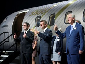 Bombardier Inc. president and chief executive officer Éric Martel, chairman of the board Pierre Beaudoin and chairman emeritus Laurent Beaudoin give a thumbs-up after unveiling a mockup of the company's new Challenger 3500 business jet at a virtual event in Montreal on September 14, 2021.