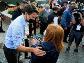 Justin Trudeau greets supporters during an election campaign stop in St-Bruno-de-Montarville, part of the all-important "450."