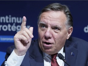 Quebec Premier François Legault responds to a question during a news conference in Montreal, on Tuesday, Sept. 7, 2021.