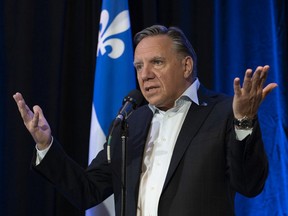 Premier François Legault responds to reporters' questions about the federal election debate, before entering a party caucus Thursday, September 9, 2021 in Quebec City. “It will be easier,” Legault said, “for Quebec to negotiate more powers with Mr. O’Toole than Mr. Trudeau.”