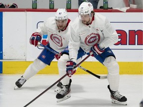 Montreal Canadiens' Jonathan Drouin, left, and Josh Anderson scrimmage during training camp on Sept. 23, 2021, in Brossard.
