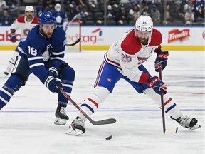 Maple Leafs' Michael Amadio battles for puck with Canadiens' Jeff Petry, right, during the first period of their pre-season game in Toronto last week.