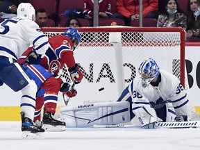 Canadiens forward Christian Dvorak (28) scores a goal against Toronto Maple Leafs goalie Jack Campbell (36) during the first period at the Bell Centre on Monday, Sept. 27, 2021.