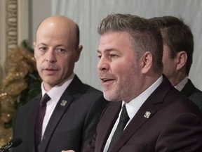 PQ MNA Joël Arseneau, left, takes over as the party's parliamentary leader from Pascal Bérubé, right.