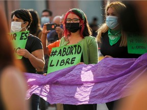 A woman holds a banner reading "Free abort" during a rally to celebrate the decision of the Supreme Court of Justice of the Nation (SCJN) that declared the criminalization of abortion as unconstitutional, in Saltillo, Mexico Sept. 7, 2021.