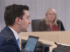 Simon Jolin-Barrette, the minister responsible for the French language, speaks at the Bill 96 committee hearings at the National Assembly, as committee president Lise Theriault looks on.