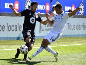 CF Montréal midfielder Mathieu Choiniere (29) and Chicago Fire FC defender Miguel Angel Navarro (6) battle for the ball during the first half at Saputo Stadium on Sunday, Sept. 19, 2021.