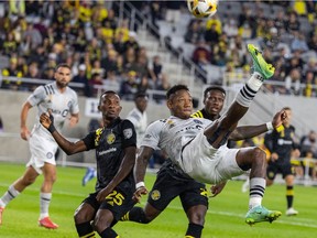 CF Montréal forward Romell Quioto (30) attempts an overhead kick while Columbus Crew defender Harrison Afful (25) defends in the first half at MAPFRE Stadium on Saturday, Sept. 25, 2021, in Columbus, Ohio.