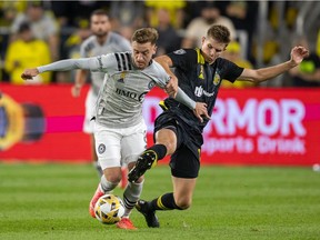 CF Montréal midfielder Djordje Mihailovic, left, dribbles the ball while Columbus Crew midfielder Liam Fraser defends in Columbus, Ohio, on Sept. 25, 2021.