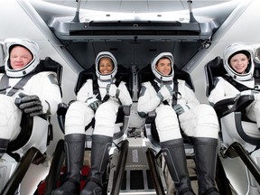 The Inspiration4 crew of Chris Sembroski, Sian Proctor, Jared Isaacman and Hayley Arceneaux sits while suited up in this picture obtained by Reuters on Sept. 15, 2021.