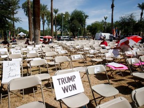 Empty seats are seen outside the Senate during the announcement of interim findings from a widely criticized audit of the 2020 election in Phoenix on Friday, Sept. 24, 2021.