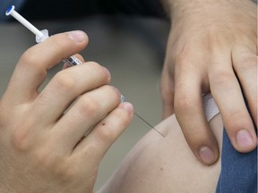 Administering the Pfizer-BioNTech COVID-19 vaccine on Thursday May 13, 2021 at the Palais des Congres. (Pierre Obendrauf / MONTREAL GAZETTE) ORG XMIT: 66138 - 2397