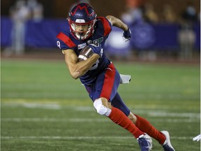 Montreal Alouettes receiver Jake Wieneke heads upfield after catching a pass against the Hamilton Tiger-Cats in Montreal on Aug. 27, 2021.