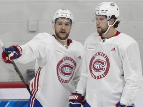 Canadiens' Jonathan Drouin, left, chats with Josh Anderson during practice last month. After dealing with anxiety and insomnia issues, Drouin has had a strong training camp and looks ready for the season to start.