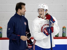 Canadiens defenceman Sami Niku chats with assistant coach Luke Richardson during training camp at the Bell Sports Complex in Brossard.