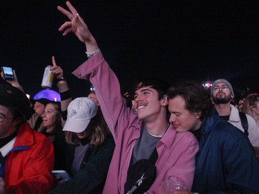Hugo Landry (gesturing) and Mathieu Cloutier enjoy Geoffroy on Day 3 of the Osheaga Get Together festival on Sunday, Oct. 3, 2021.