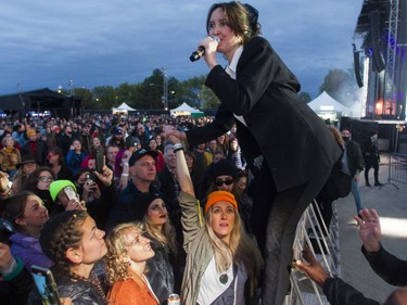 Leah Fay of the band July Talk is held up by fans on Day 3 of the Osheaga Get Together festival on Sunday, Oct. 3, 2021.