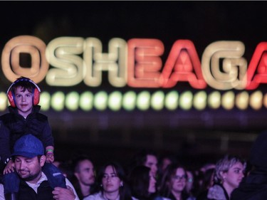 Miguel Burnier Jr. watches acts from the shoulders of his father, Miguel Burnier, on Day 3 of the Osheaga Get Together festival on Sunday, Oct. 3, 2021.